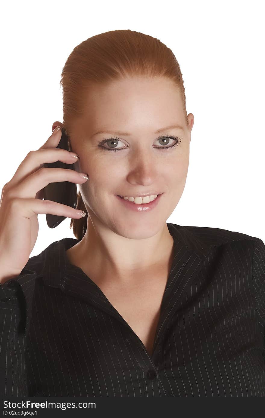 Young red haired lady talking on the phone. Young red haired lady talking on the phone