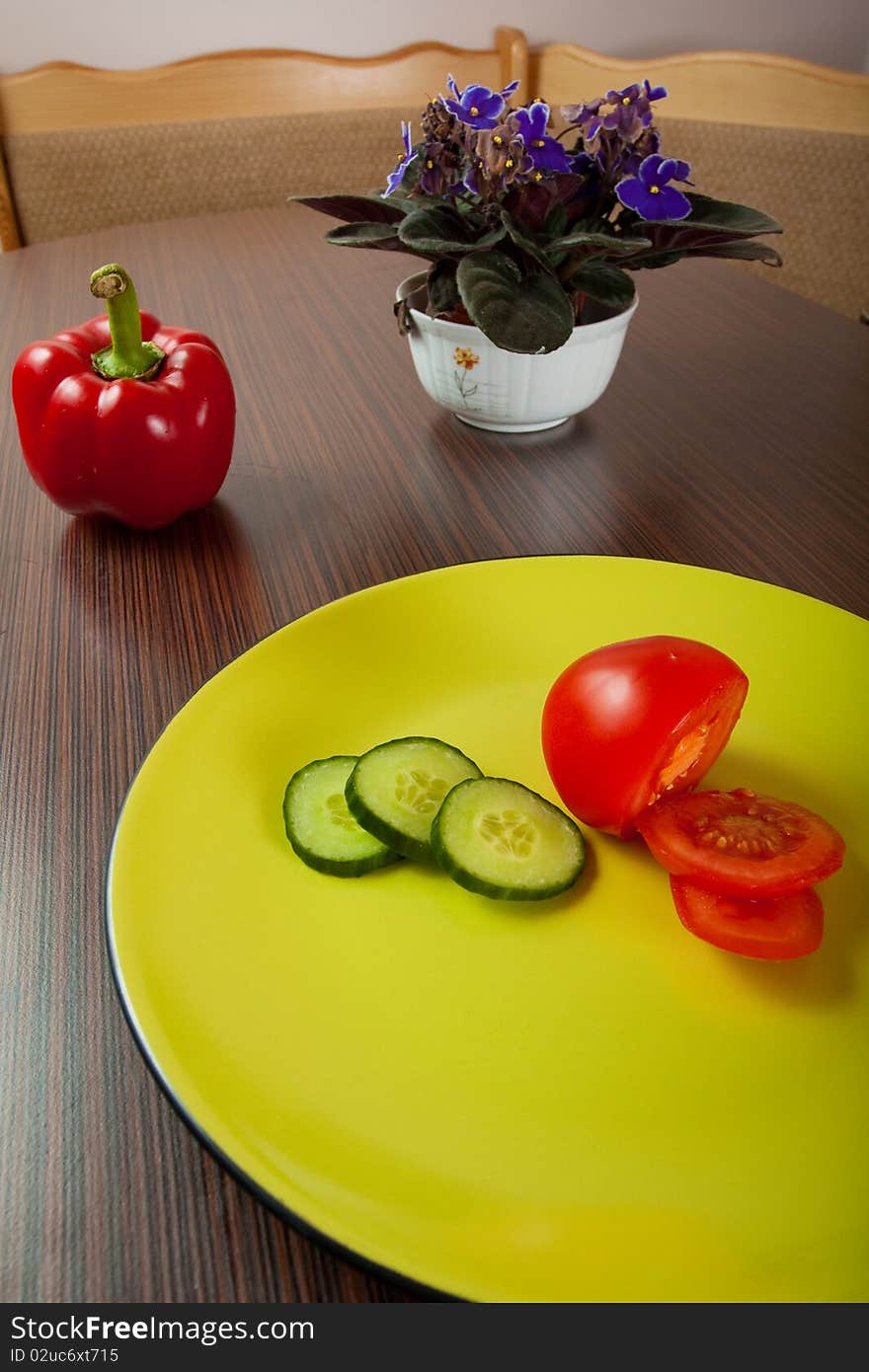 Vegetables on green plate on table