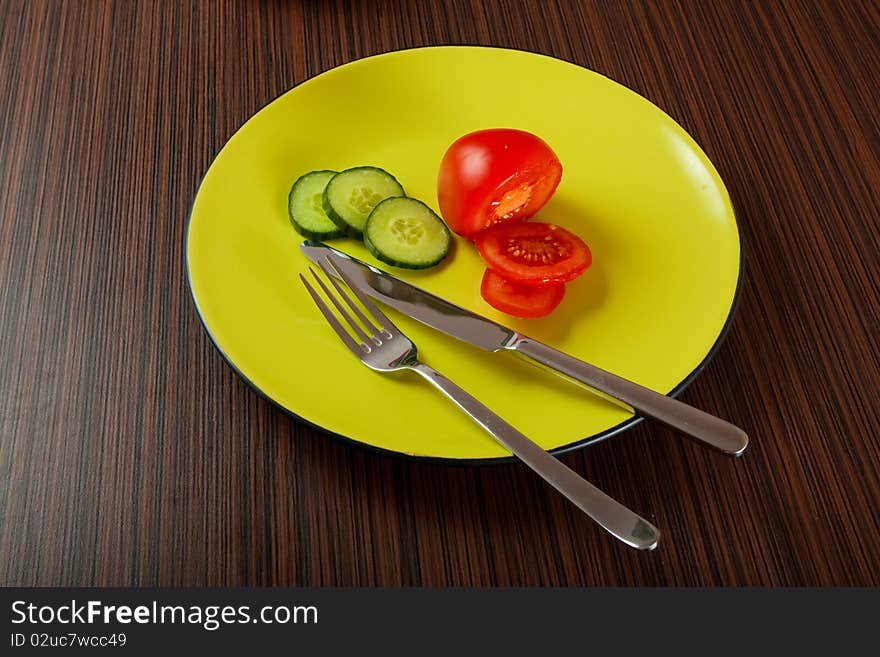 Vegetables on green plate on table