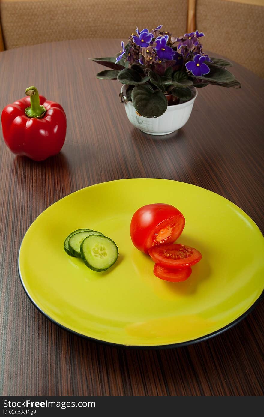 Vegetables on green plate on table