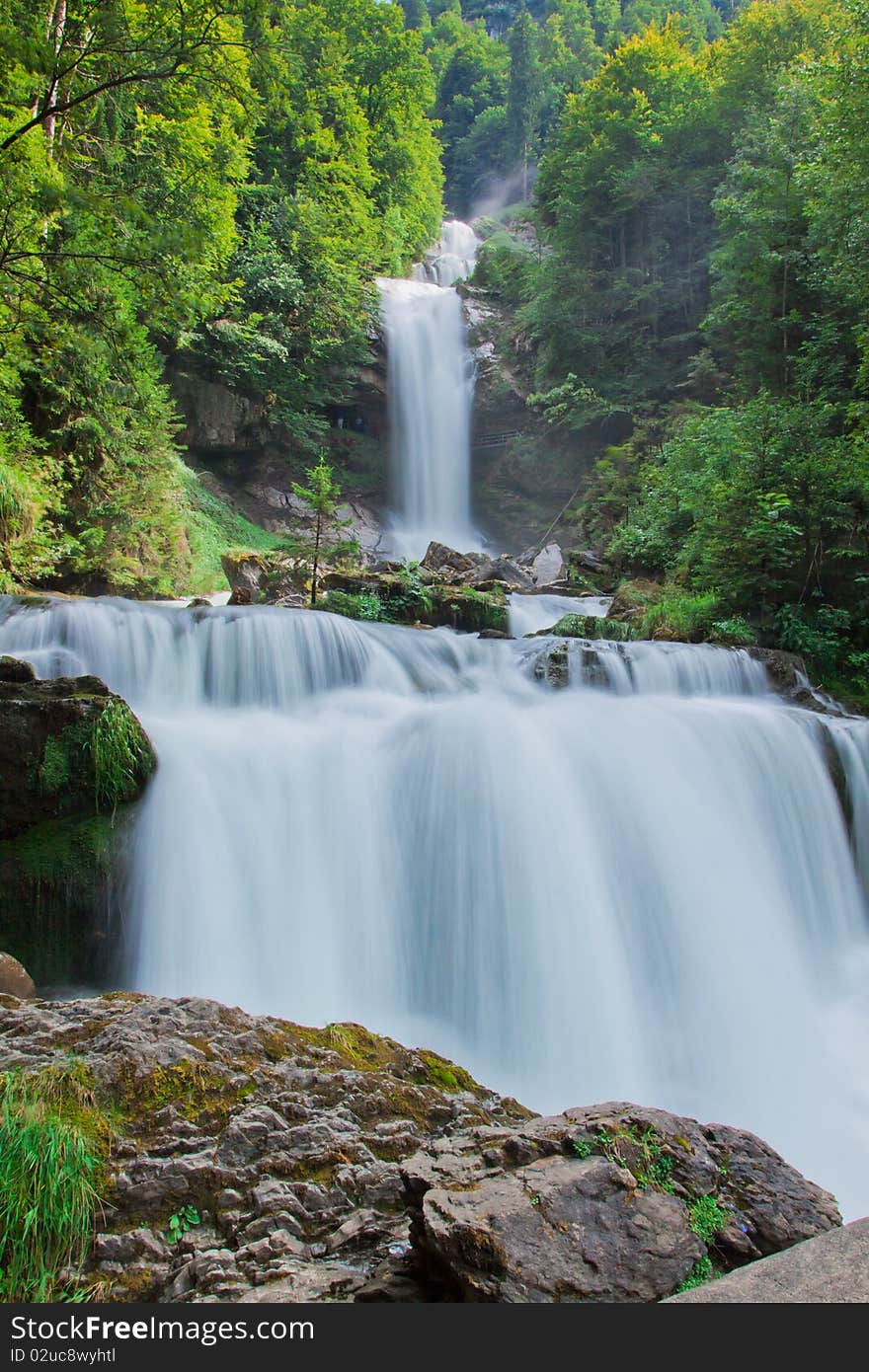 Waterfall in green nature in Switzerland