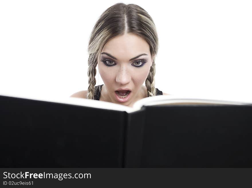 Young pretty girl reading a book