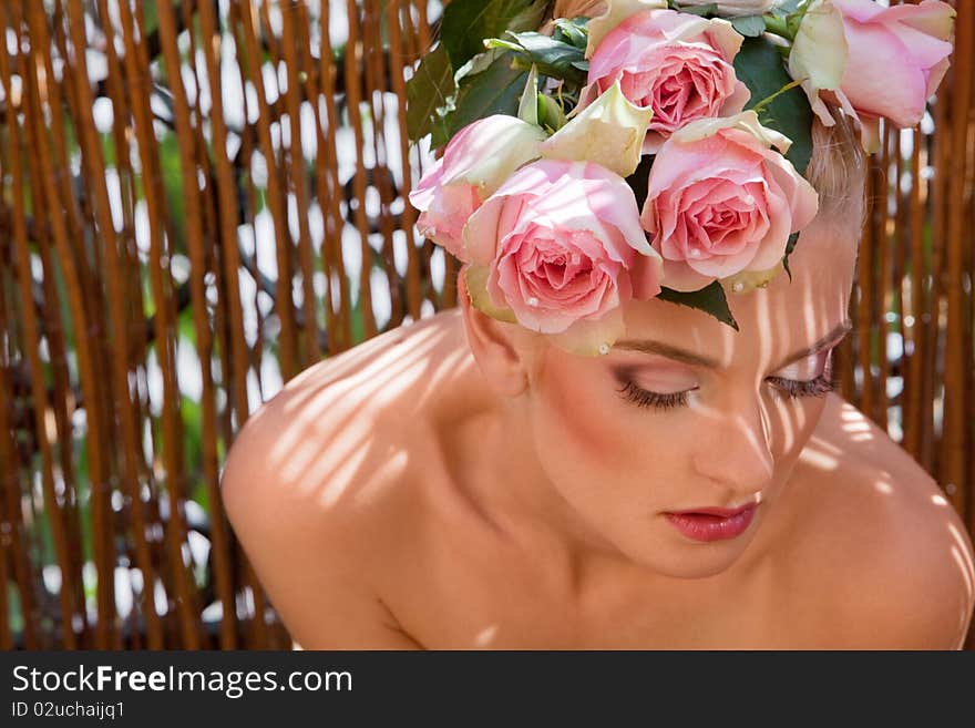 Portrait of blonde with a wreath of flowers