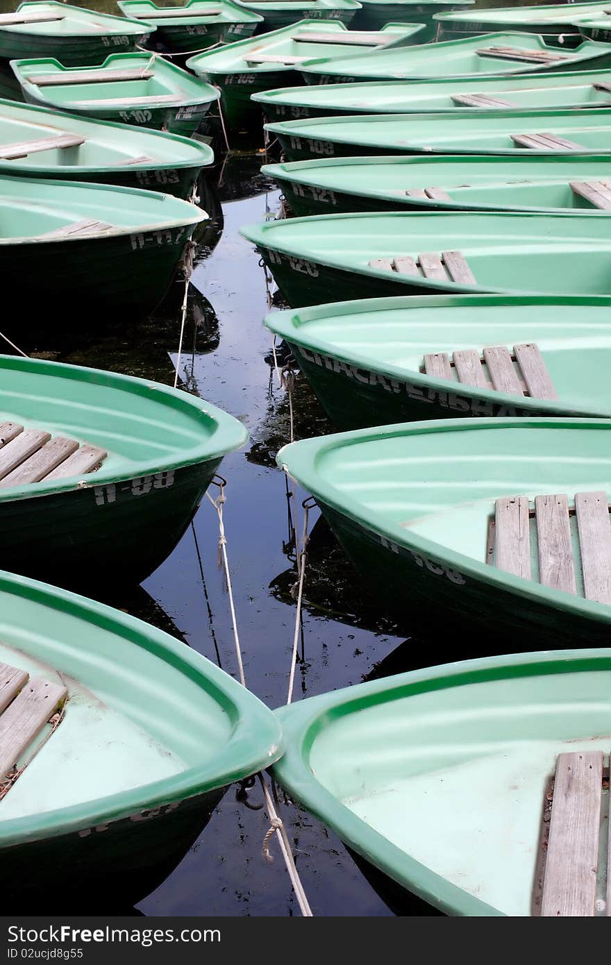 Green boats on the water. Green boats on the water