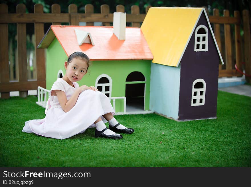 Little girl and house like Fairy tale