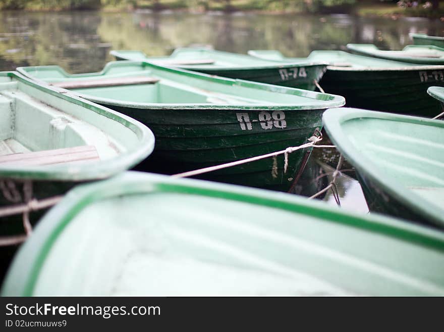 Green boats on the water. Green boats on the water