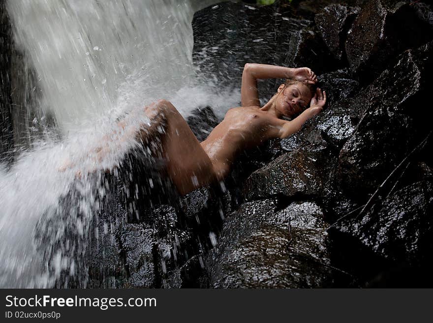 Young Nude Woman Swimming