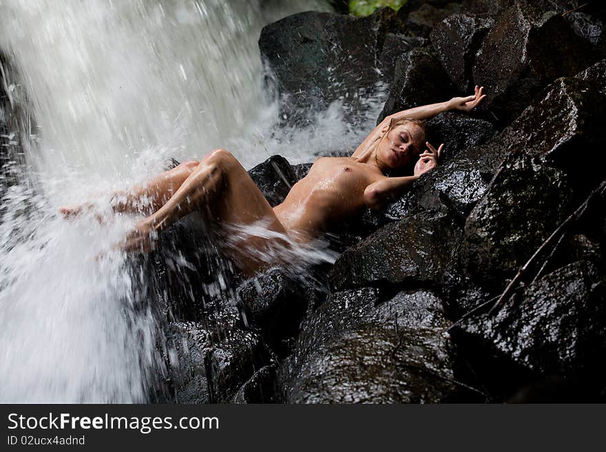 Young Nude Woman Swimming