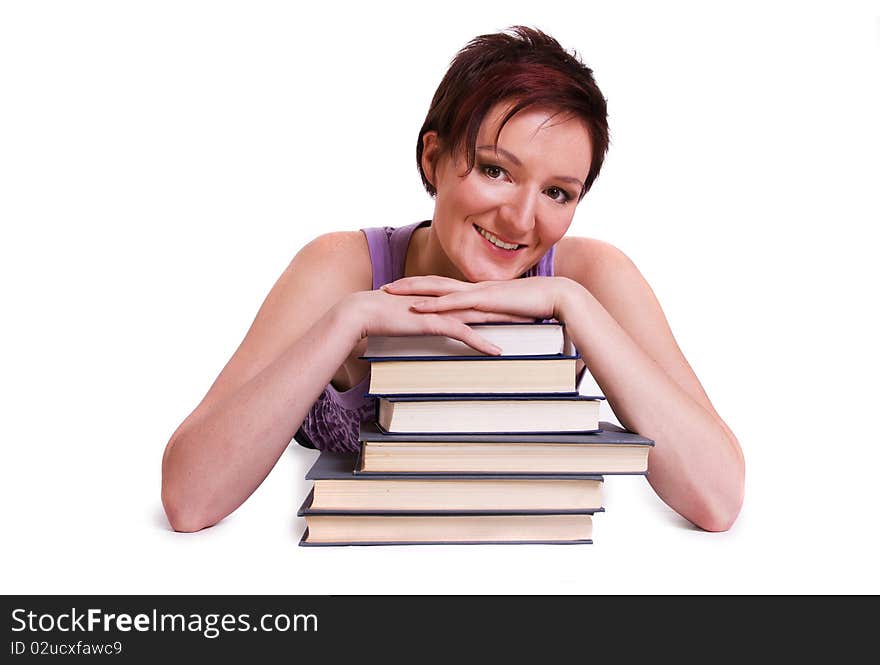 Girl doing her homework. Studying cheerful young woman reading her book for school. Woman with books. Girl doing her homework. Studying cheerful young woman reading her book for school. Woman with books