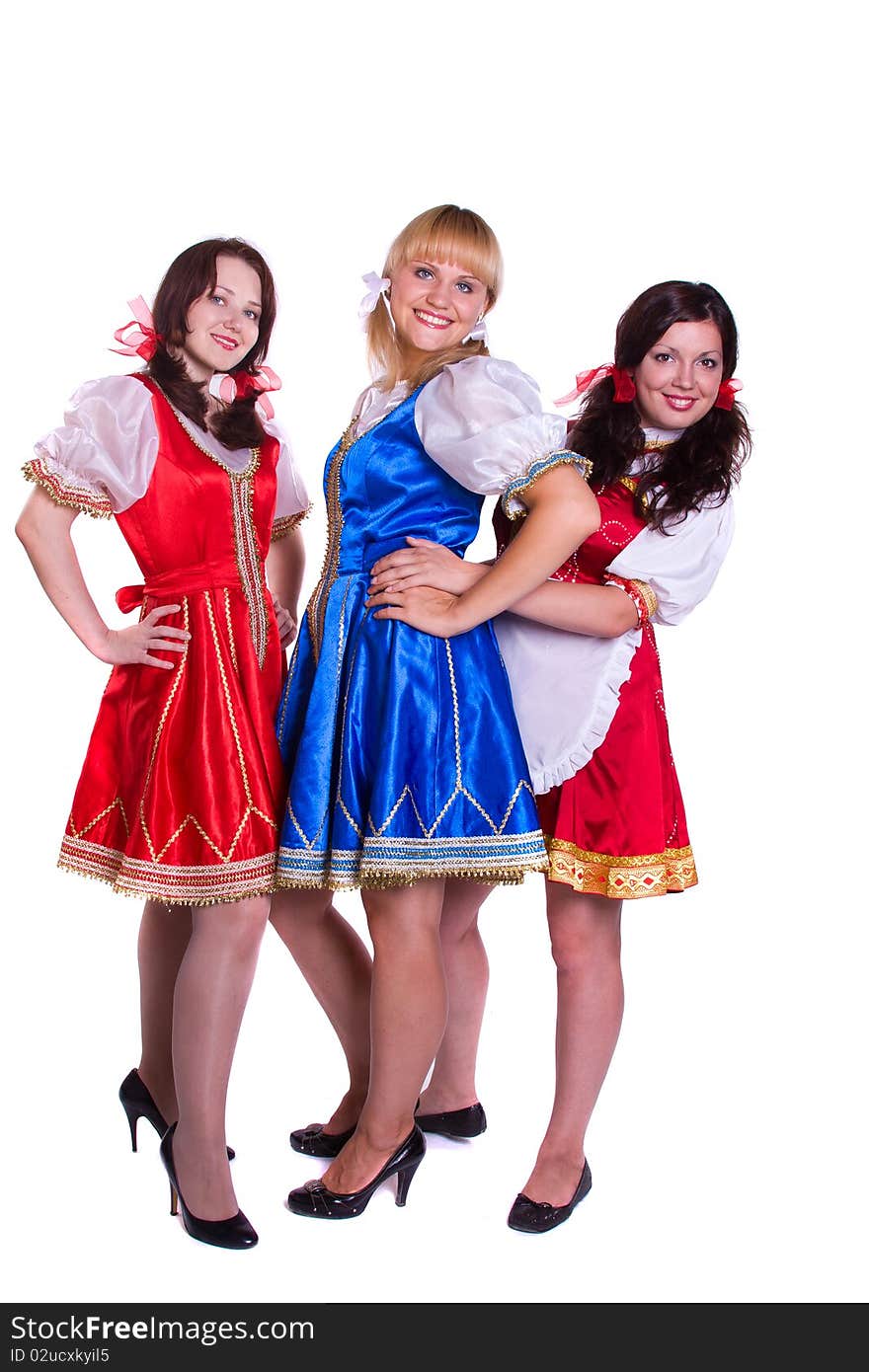 Three German/Bavarian girl s with a traditional Oktoberfest Ma?krug. Smiling woman in Bavarian drindl. Three German/Bavarian girl s with a traditional Oktoberfest Ma?krug. Smiling woman in Bavarian drindl