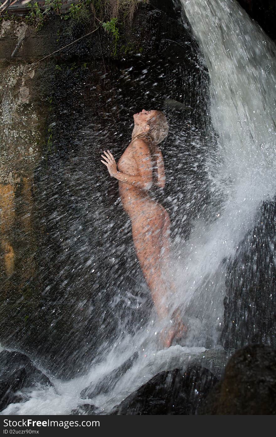 Young Nude Woman Swimming