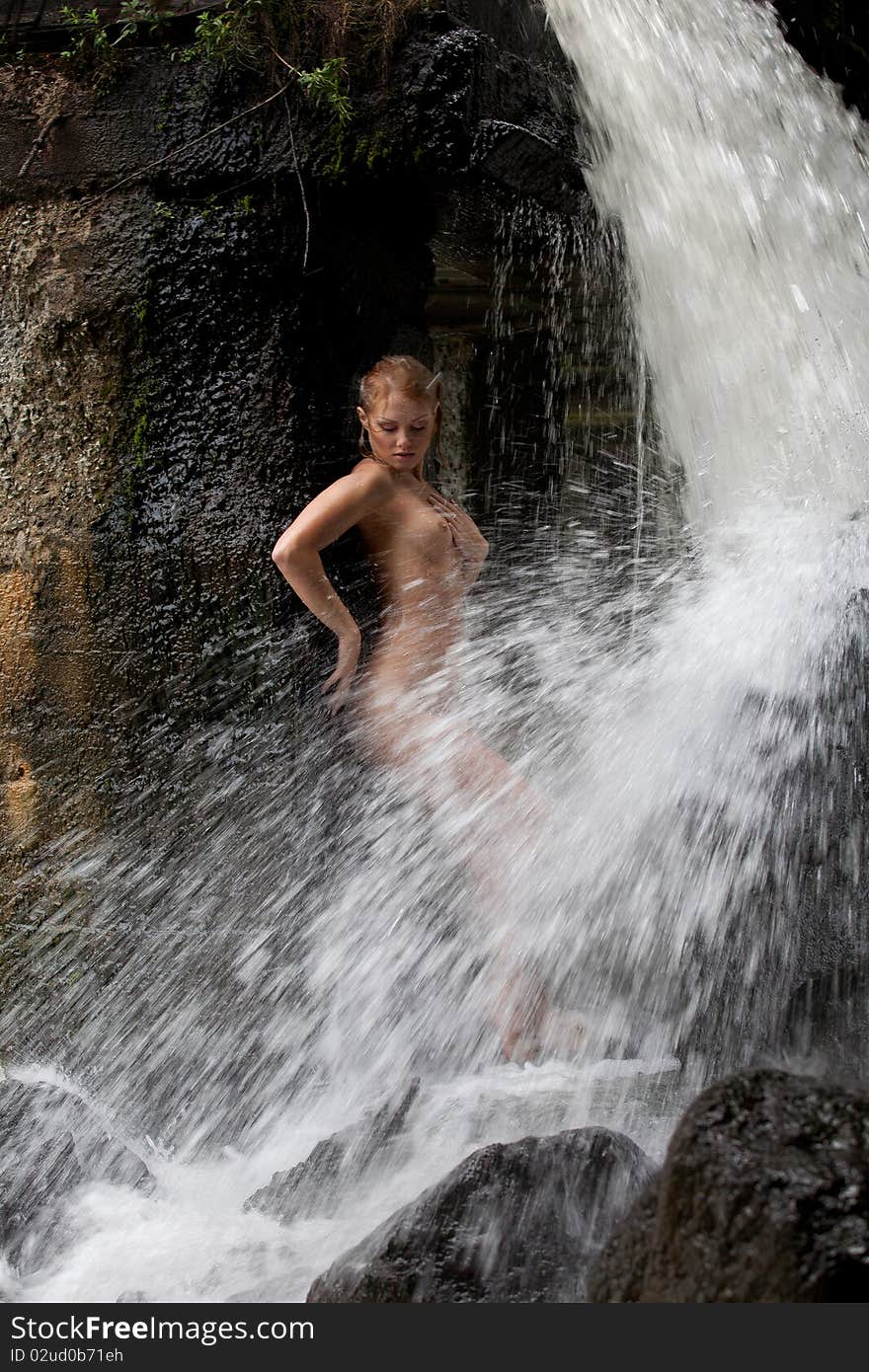 Young Nude Woman Swimming