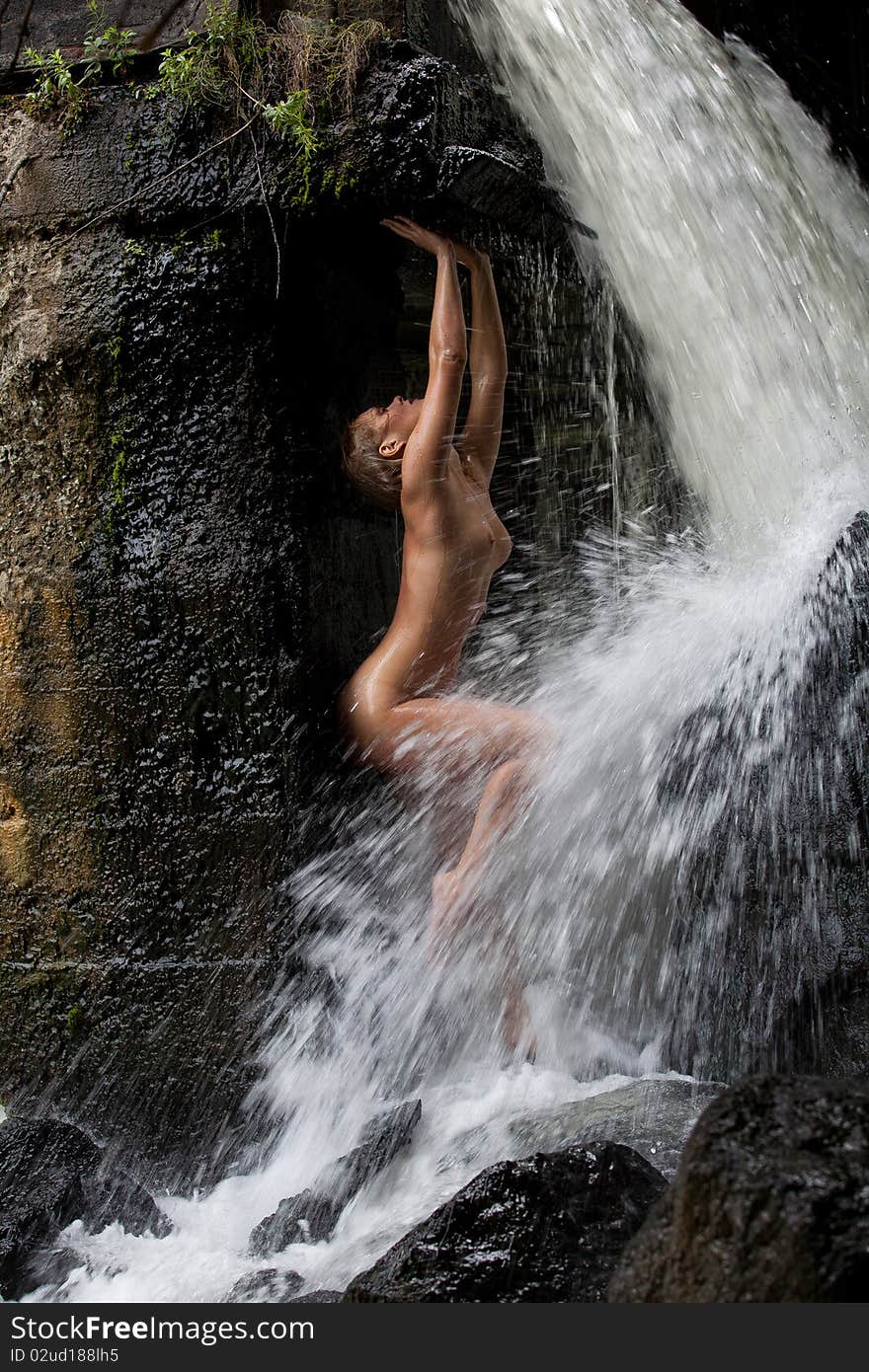 Young Nude Woman Swimming