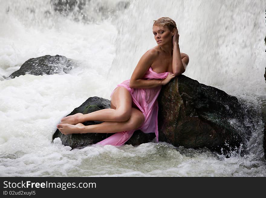 Young Nude Woman Swimming