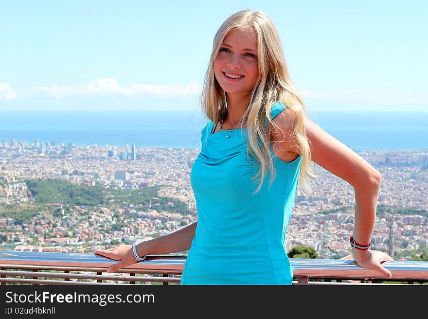 Portrait of a smiling girl on top of the building in Spain. Portrait of a smiling girl on top of the building in Spain.