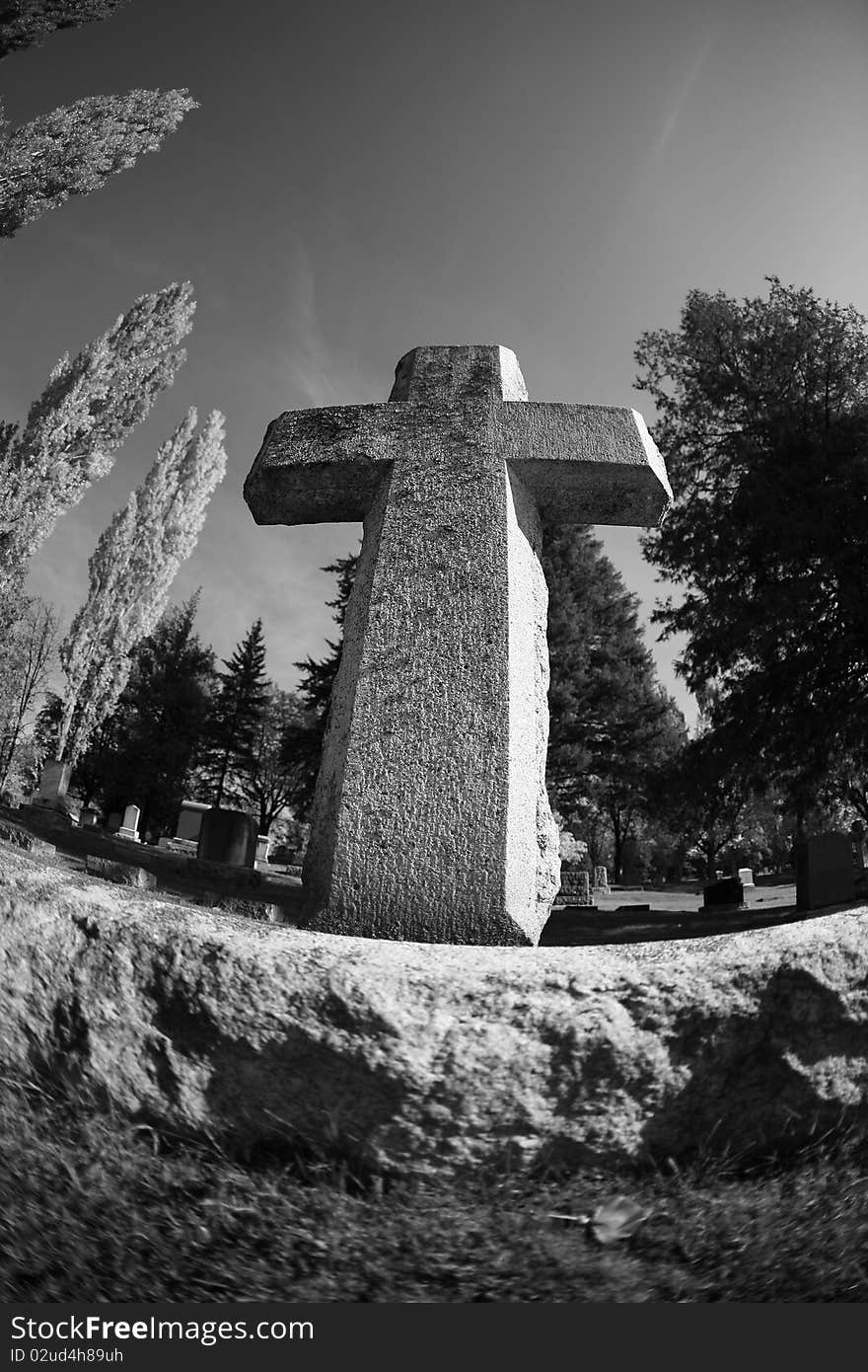 Powerful angle of a cross in a cemetary. Powerful angle of a cross in a cemetary.