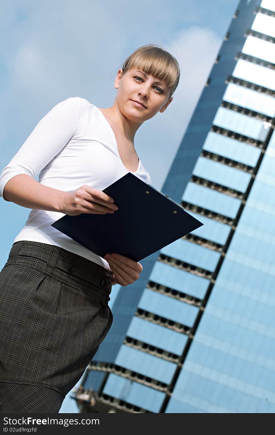 Beauty business woman on modern glass building with document