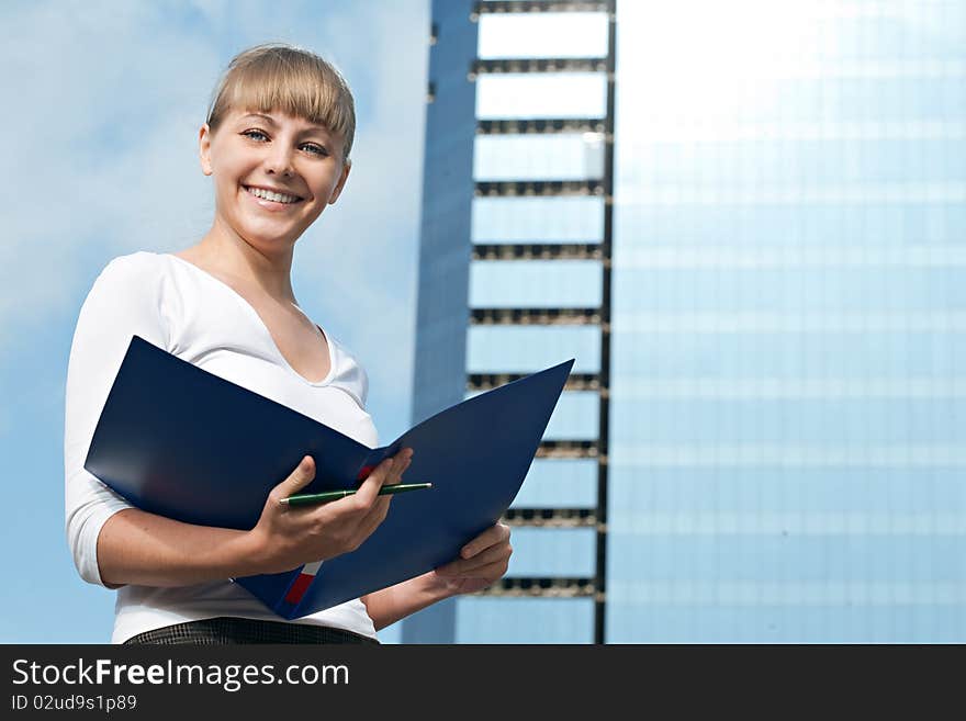 Beauty business woman on modern glass building with document