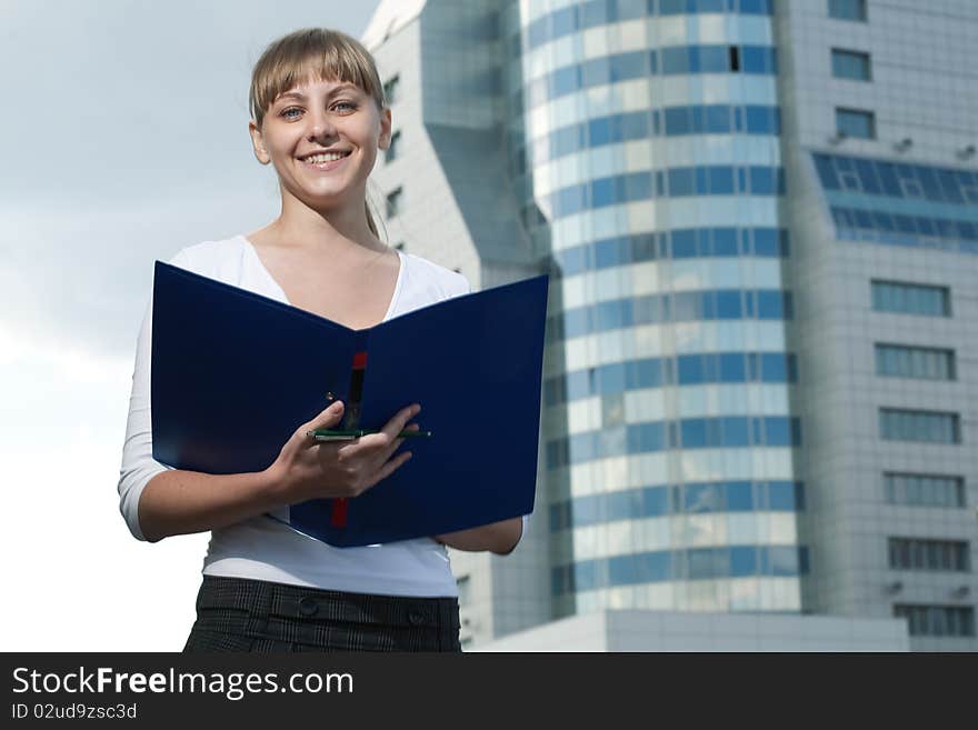 Beauty business woman on modern glass building with document