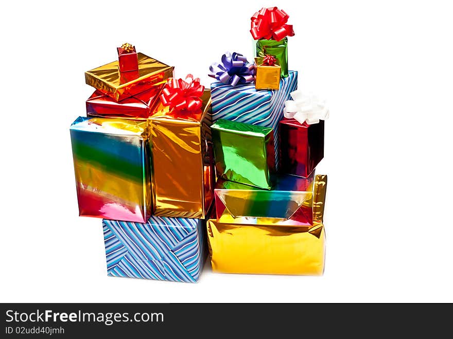 Stack of colored gift boxes with bows. Isolated on white. Stack of colored gift boxes with bows. Isolated on white