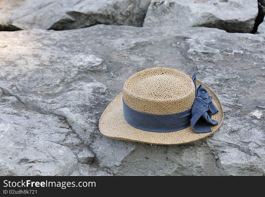 Straw hat on rocks