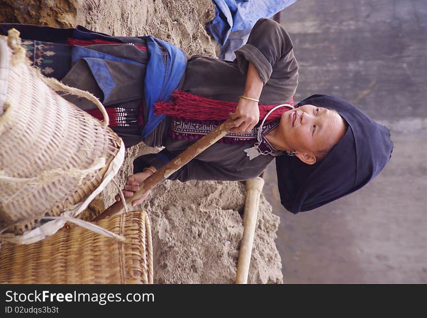 Male Black Dao minority in the region of Lai Chau. Here this woman is the earthworks for the arrival of running water from a house in the nearby town. Male Black Dao minority in the region of Lai Chau. Here this woman is the earthworks for the arrival of running water from a house in the nearby town.