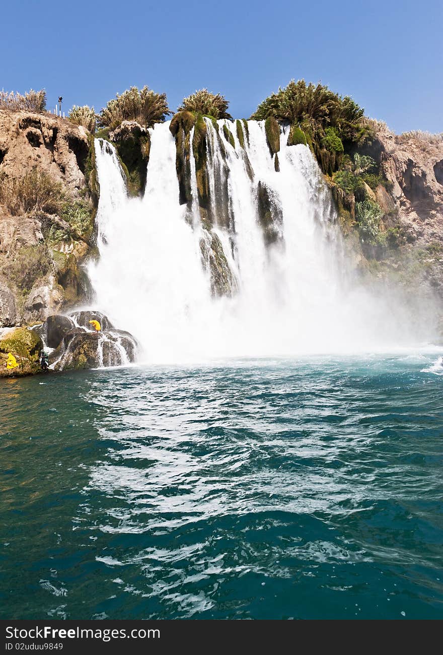 High waterfall flowing into the Sea