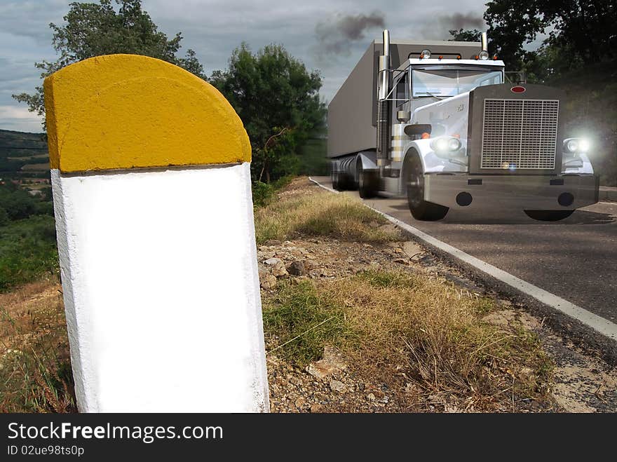 On a mountain road, a heavy truck of transportation of goods, lit switched on.
At the foreground, a road border without registration, to place the wished text there. (Phone number, name of a company, a logo, a slogan...). On a mountain road, a heavy truck of transportation of goods, lit switched on.
At the foreground, a road border without registration, to place the wished text there. (Phone number, name of a company, a logo, a slogan...)