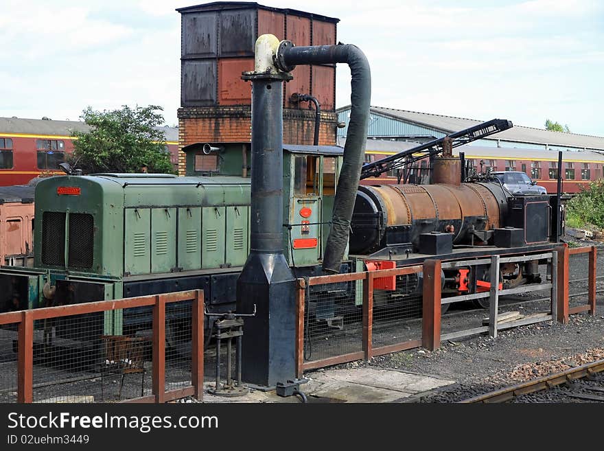 Diesil & steam locomotives sitting in railway siding at boness railway museum. Diesil & steam locomotives sitting in railway siding at boness railway museum