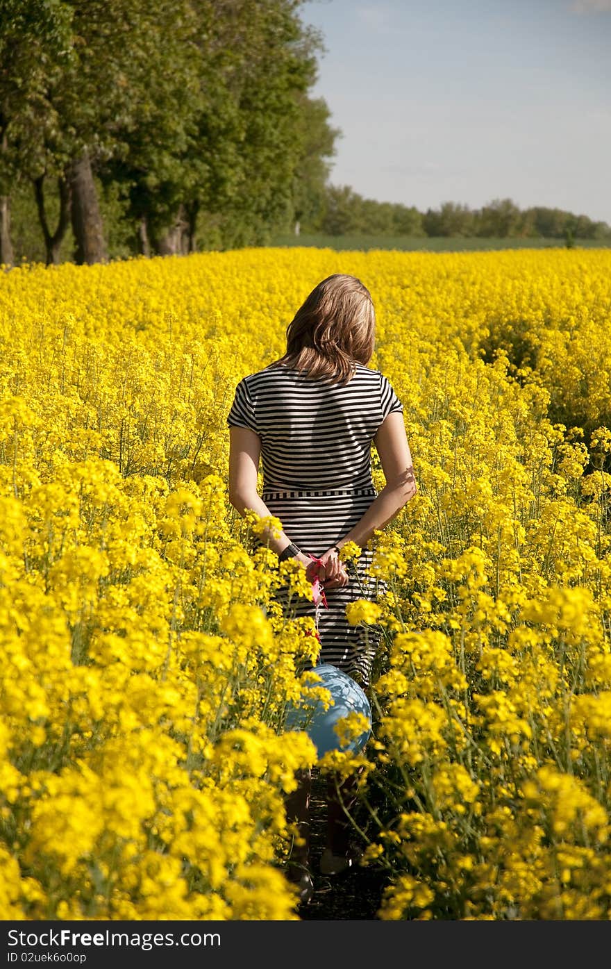 Girl On Canola Field