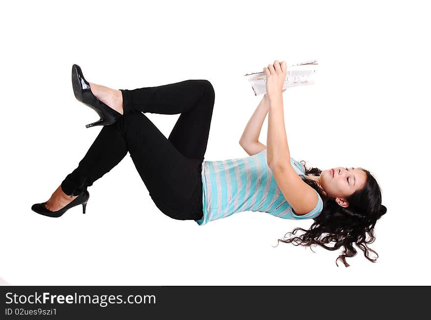 An beautiful woman with long brunette hair lying on the floor in black jeans
and a sweater, reading a book, for light gray background. An beautiful woman with long brunette hair lying on the floor in black jeans
and a sweater, reading a book, for light gray background.