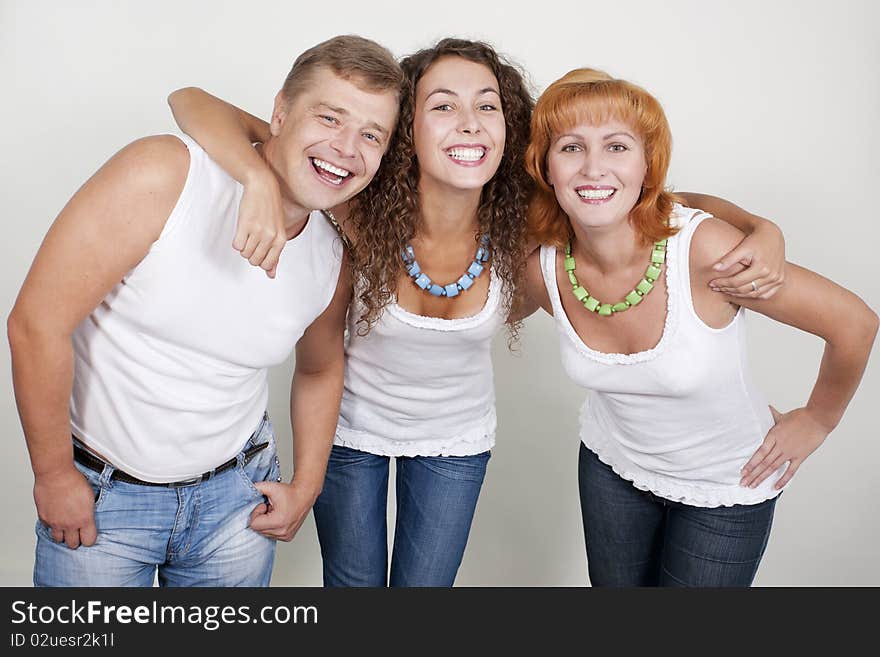 Happy family, parents with their grown-up daughter.