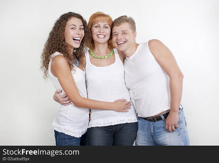 Happy family, parents with their grown-up daughter.