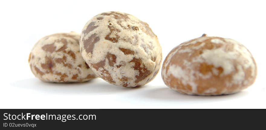 Three round spice-cakes on the white background, are isolated.