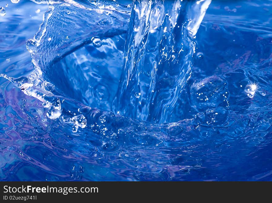 Blue Water drop  on ripple surface