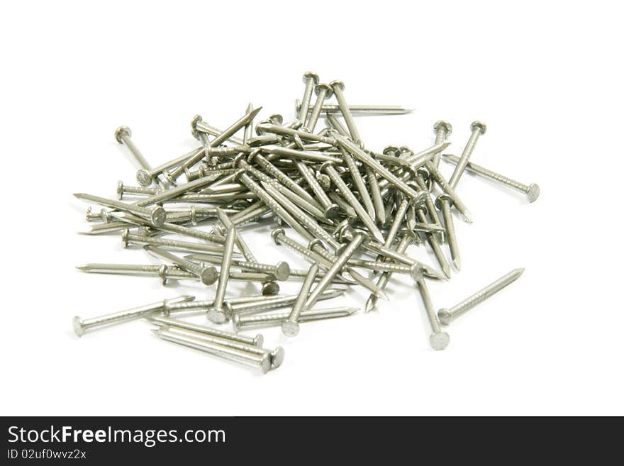 Place nails scattered on a white background.