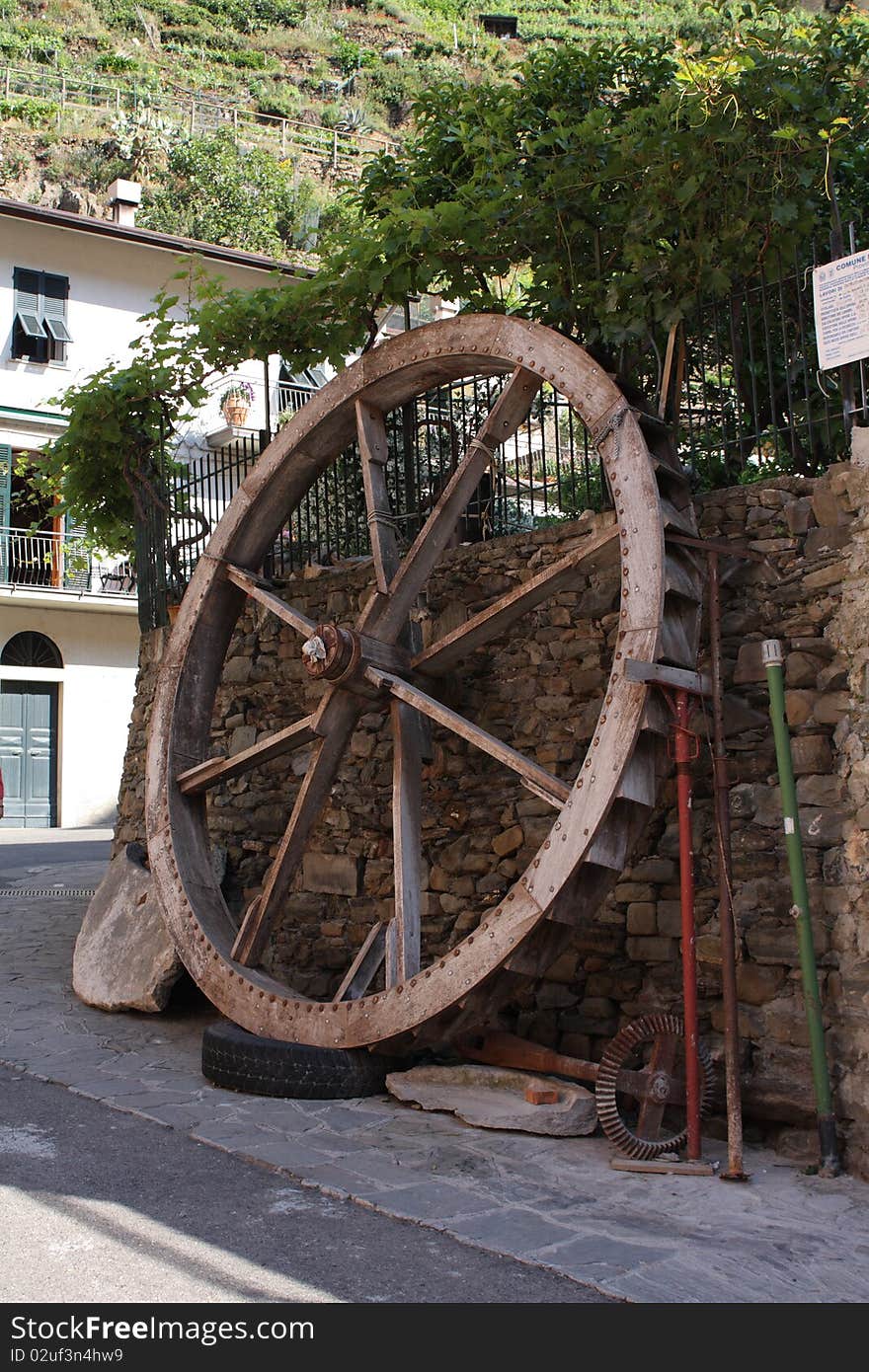 Old water wheel in small Italian village