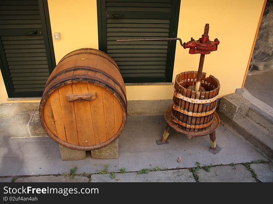 Wine barrel and press in small italian village