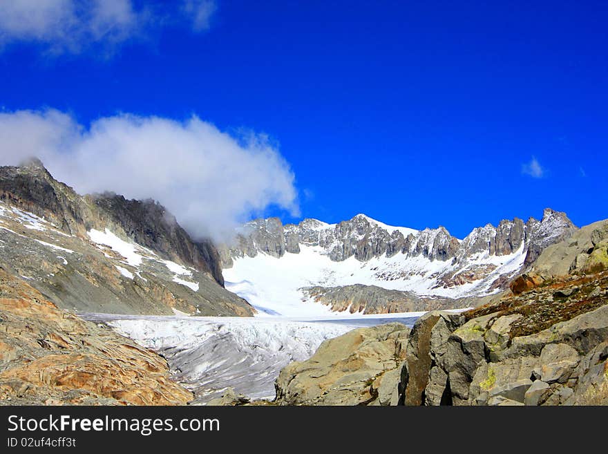 Glacier With Snow Capped Mountains