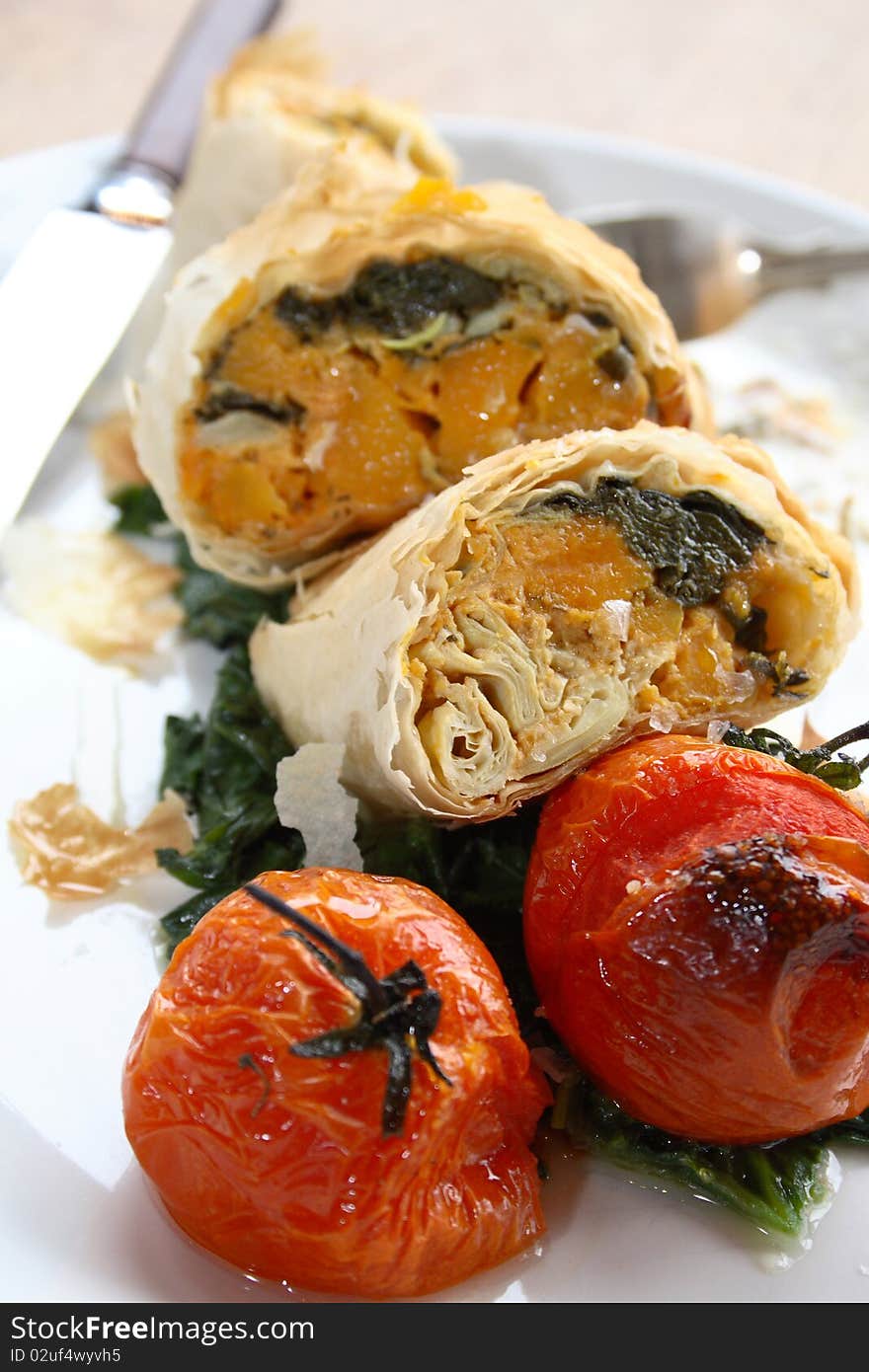 Close-up of filo parcels with roasted tomatoes