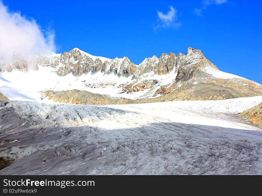 Glacier With Snow Capped Mountains