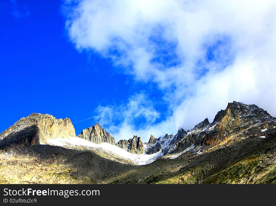 Snow mountains and blue skies