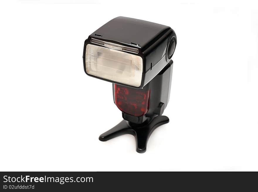 A professional flashgun isolated on a white background.