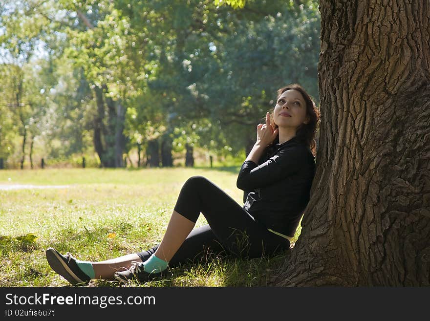 Happy beautiful girl in forest