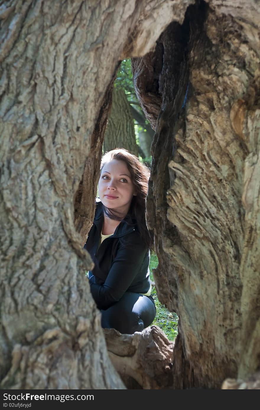 Happy beautiful girl in forest