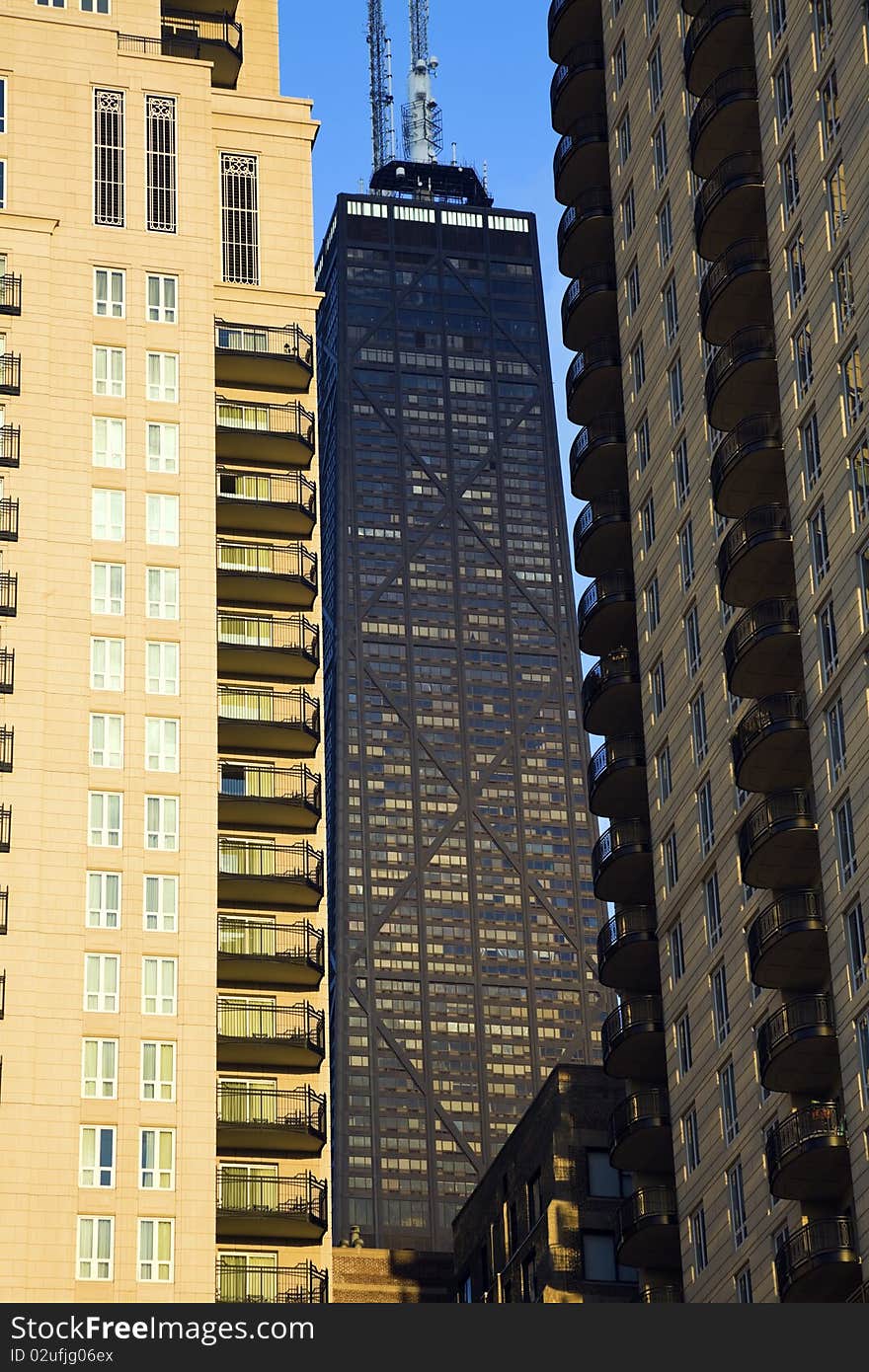 Hancock Tower squized between skyscrapers in downtown Chicago, IL.