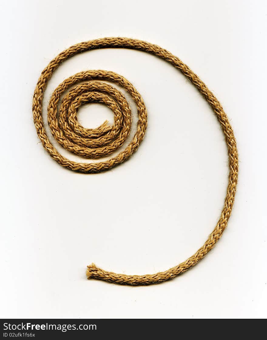 Spiral rope made from natural fibers on the white background