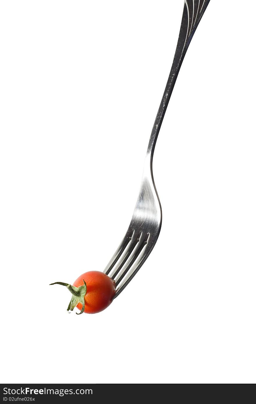 Fresh cherry tomato on the fork (isolated on white)