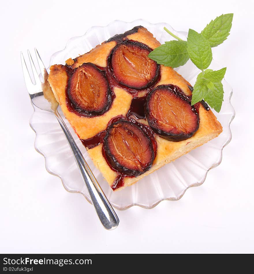 Piece of Plum Pie decorated with a mint twig