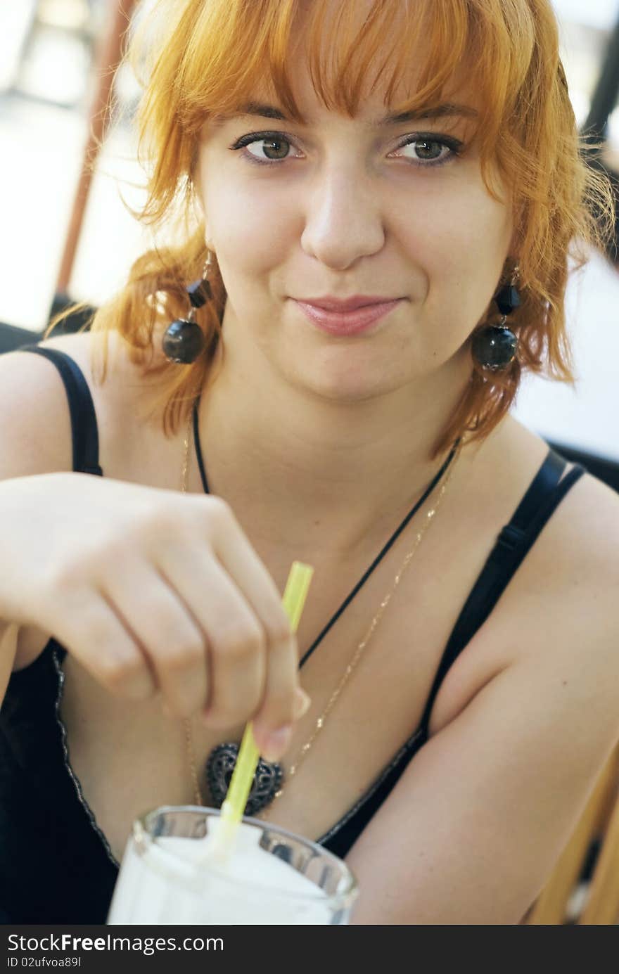 Young Red Woman With Milk-shake